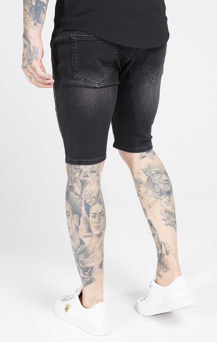 Laad de afbeelding in de Galerij viewer, Zwarte skinny jeansshort met gedragen look en versleten details (1)