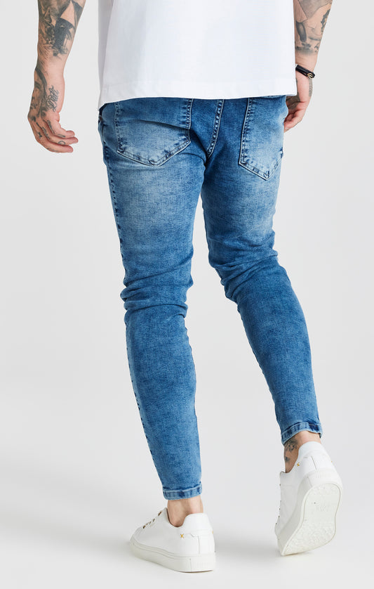 Essentials - Blauwe half verwassen skinny jeans met een gedragen look en versleten details