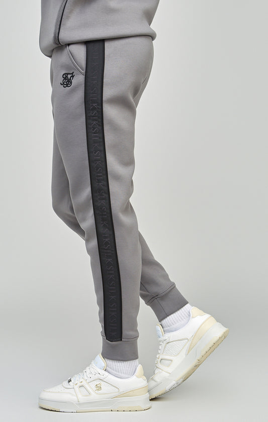 Set van een joggingbroek en een sweater met capuchon en volledige rits, in het grijs en met zijbanden
